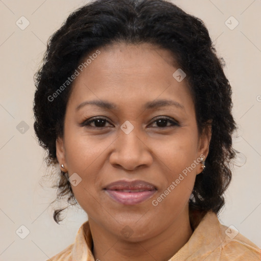 Joyful black adult female with medium  brown hair and brown eyes