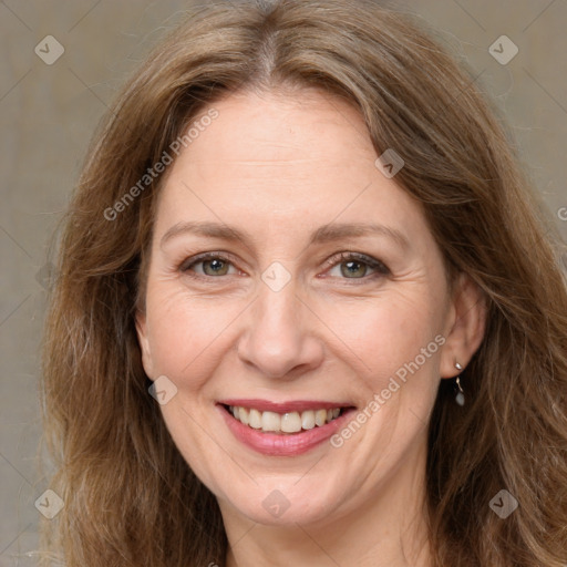 Joyful white adult female with long  brown hair and grey eyes