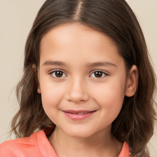 Joyful white child female with long  brown hair and brown eyes