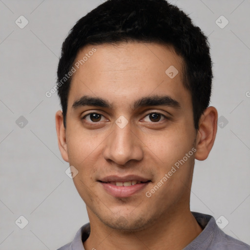 Joyful white young-adult male with short  black hair and brown eyes