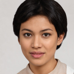 Joyful latino young-adult female with short  black hair and brown eyes