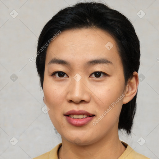 Joyful asian young-adult female with medium  brown hair and brown eyes