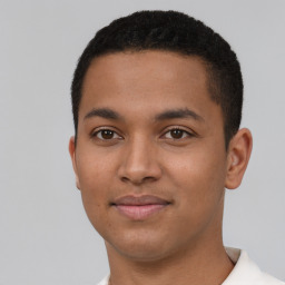 Joyful latino young-adult male with short  brown hair and brown eyes