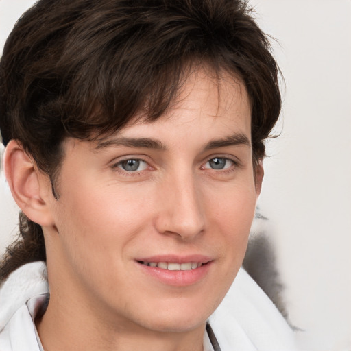 Joyful white young-adult male with medium  brown hair and brown eyes