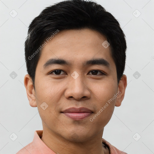 Joyful asian young-adult male with short  black hair and brown eyes