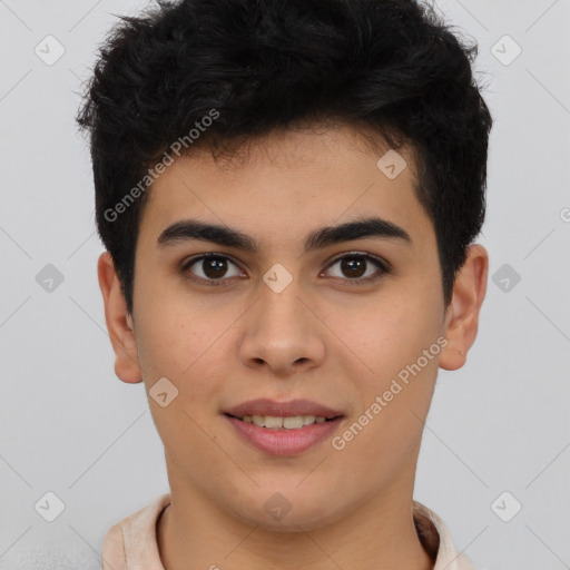 Joyful latino young-adult male with short  brown hair and brown eyes