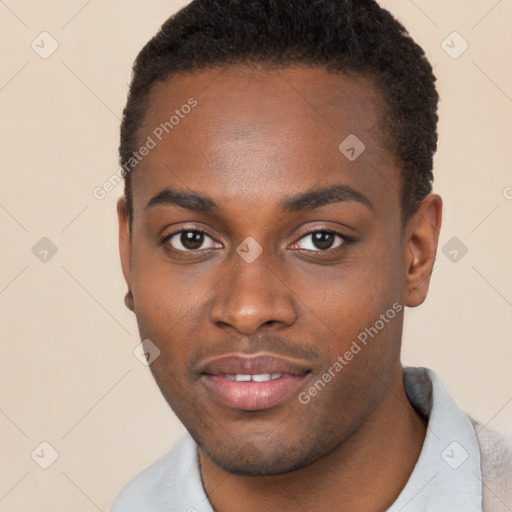 Joyful black young-adult male with short  brown hair and brown eyes