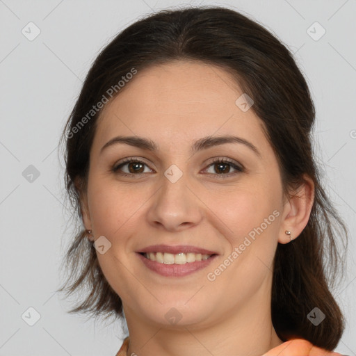 Joyful white young-adult female with medium  brown hair and brown eyes