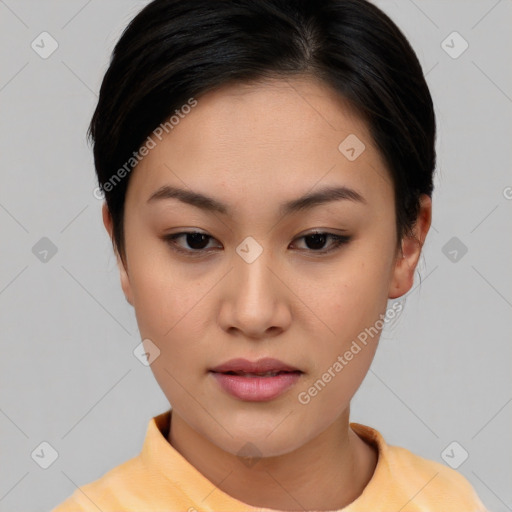 Joyful asian young-adult female with short  brown hair and brown eyes