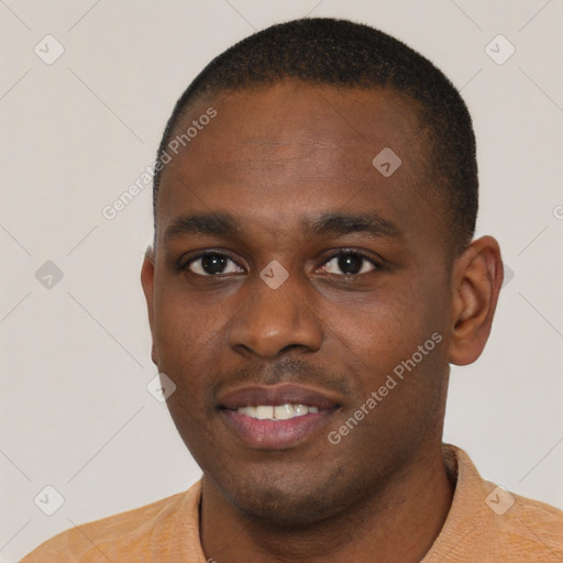 Joyful latino young-adult male with short  brown hair and brown eyes