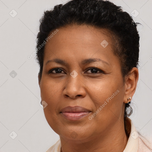 Joyful latino adult female with short  brown hair and brown eyes