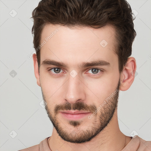 Neutral white young-adult male with short  brown hair and brown eyes