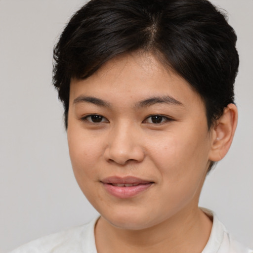 Joyful asian young-adult female with medium  brown hair and brown eyes
