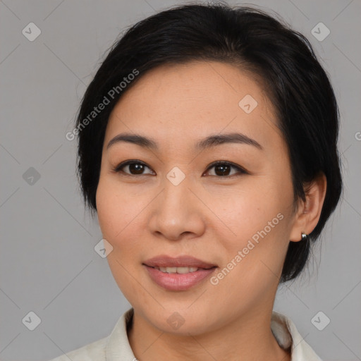 Joyful asian young-adult female with medium  brown hair and brown eyes