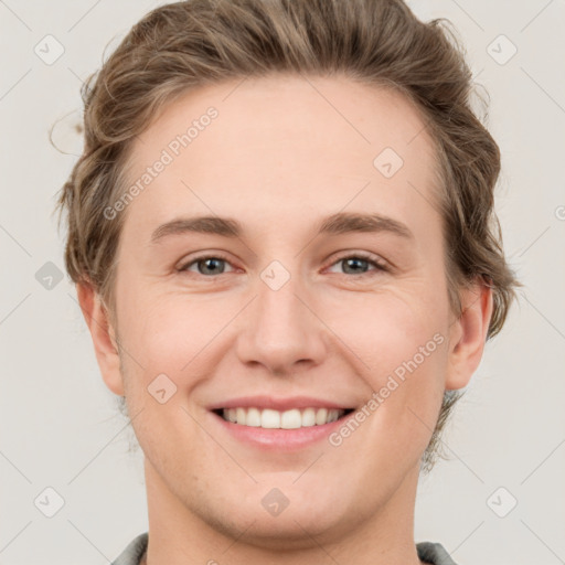 Joyful white young-adult female with short  brown hair and grey eyes