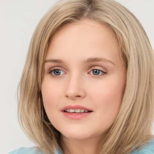 Joyful white young-adult female with medium  brown hair and green eyes