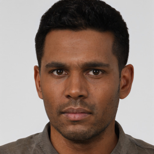 Neutral latino young-adult male with short  black hair and brown eyes