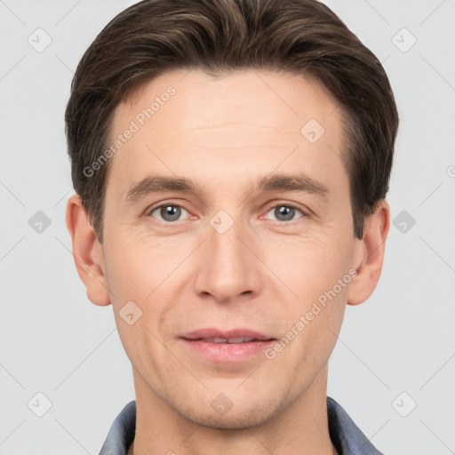 Joyful white adult male with short  brown hair and brown eyes