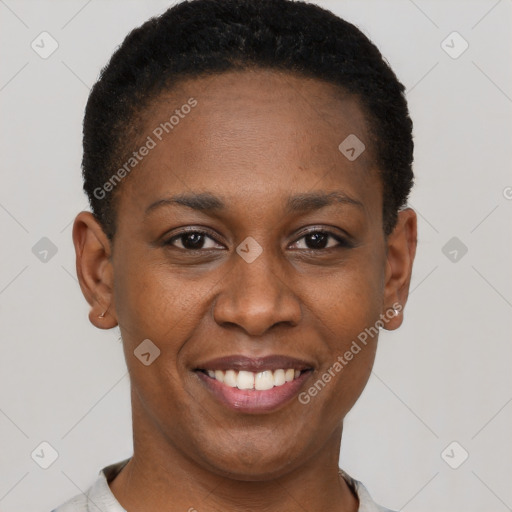 Joyful black young-adult female with short  black hair and brown eyes