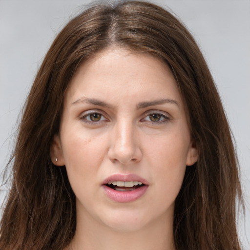 Joyful white young-adult female with long  brown hair and brown eyes