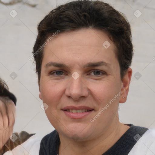 Joyful white adult female with short  brown hair and brown eyes