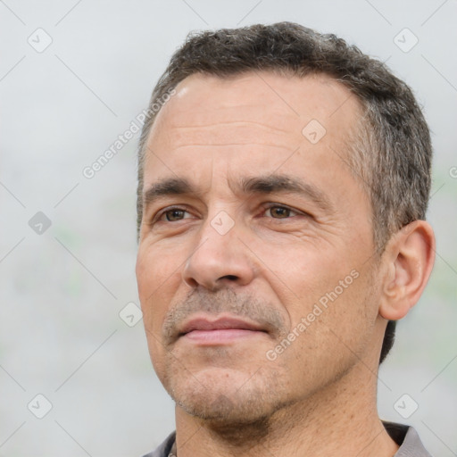 Neutral white adult male with short  black hair and brown eyes
