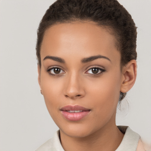 Joyful latino young-adult female with short  brown hair and brown eyes