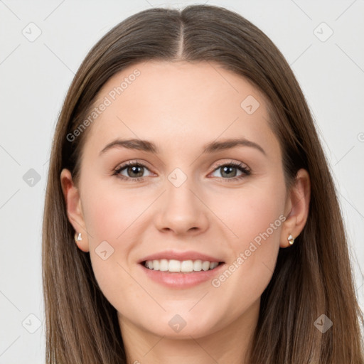 Joyful white young-adult female with long  brown hair and grey eyes