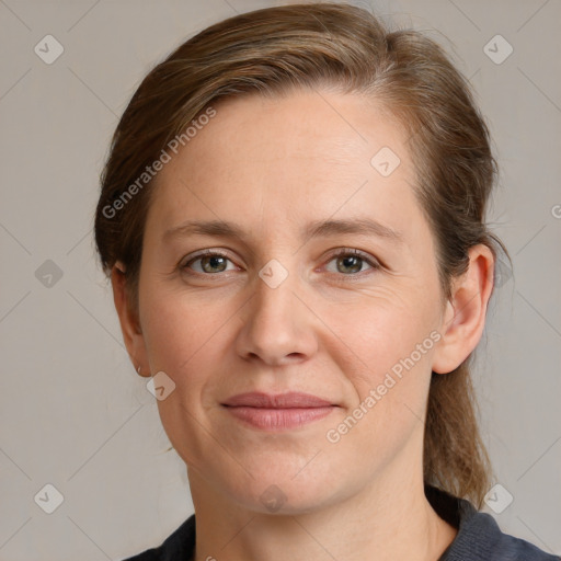 Joyful white adult female with medium  brown hair and grey eyes