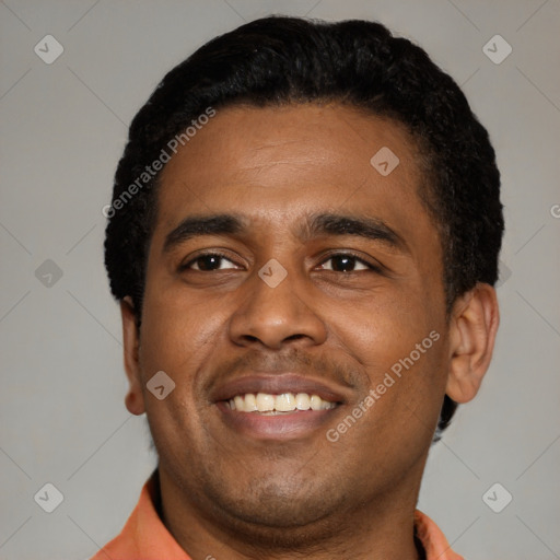 Joyful latino young-adult male with short  black hair and brown eyes
