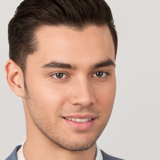 Joyful white young-adult male with short  brown hair and brown eyes