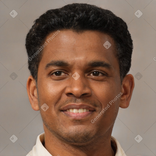 Joyful latino young-adult male with short  brown hair and brown eyes
