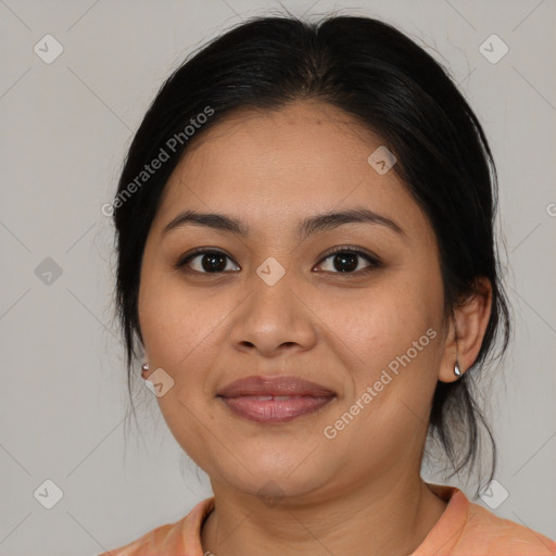 Joyful latino young-adult female with medium  brown hair and brown eyes