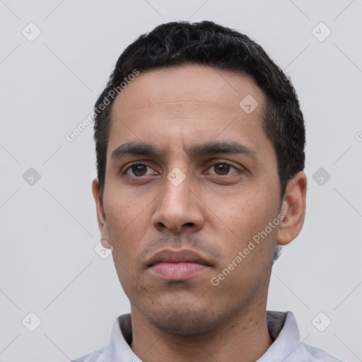 Neutral latino young-adult male with short  black hair and brown eyes