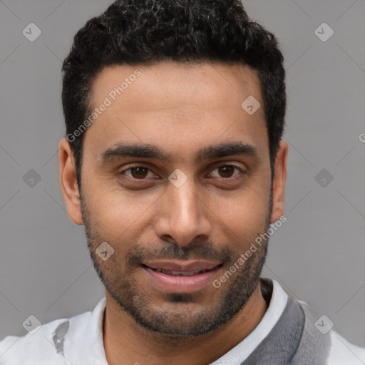 Joyful white young-adult male with short  black hair and brown eyes