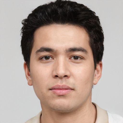 Neutral white young-adult male with short  black hair and brown eyes