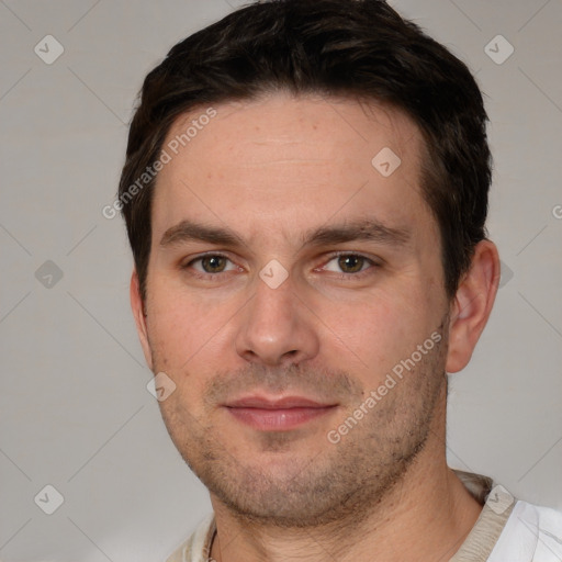 Joyful white adult male with short  brown hair and brown eyes