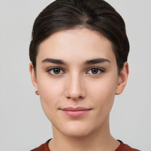 Joyful white young-adult female with short  brown hair and brown eyes