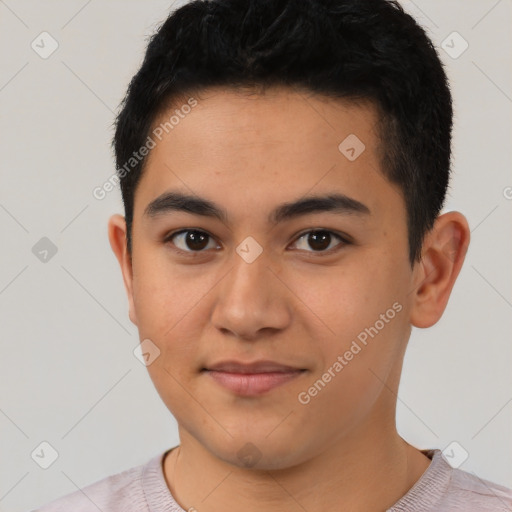 Joyful latino young-adult male with short  black hair and brown eyes