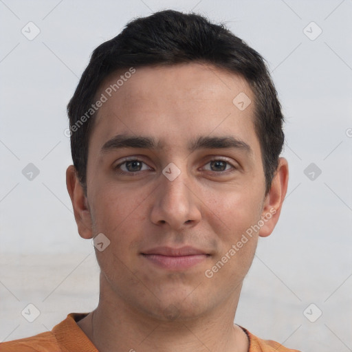 Joyful white young-adult male with short  black hair and brown eyes