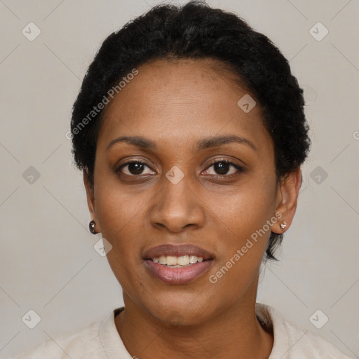 Joyful black adult female with short  black hair and brown eyes