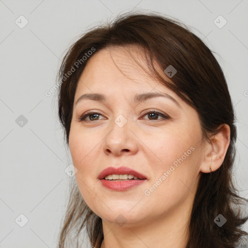 Joyful white adult female with medium  brown hair and brown eyes