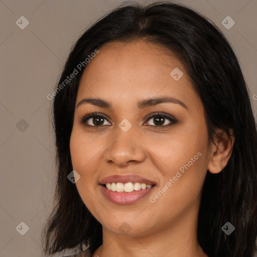 Joyful latino young-adult female with long  brown hair and brown eyes