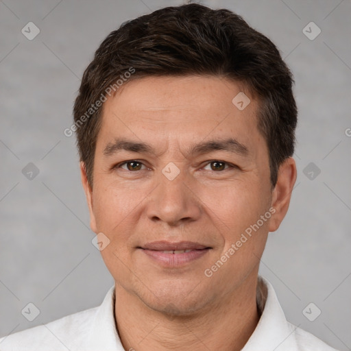 Joyful white adult male with short  brown hair and brown eyes