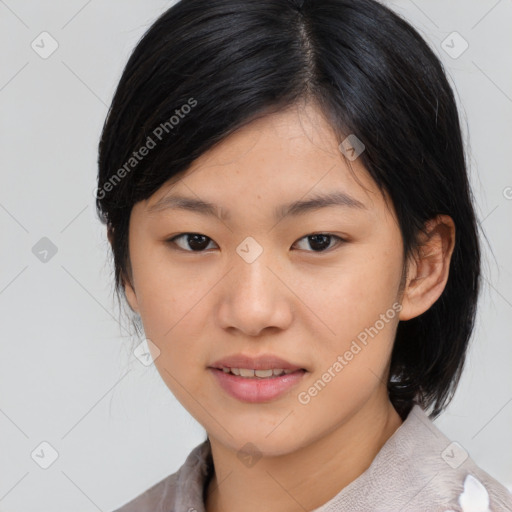 Joyful asian young-adult female with medium  black hair and brown eyes