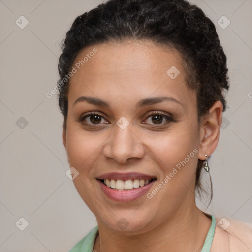 Joyful latino young-adult female with short  brown hair and brown eyes