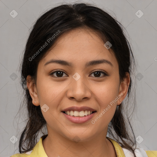 Joyful latino young-adult female with medium  brown hair and brown eyes