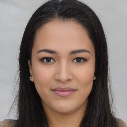 Joyful asian young-adult female with long  brown hair and brown eyes