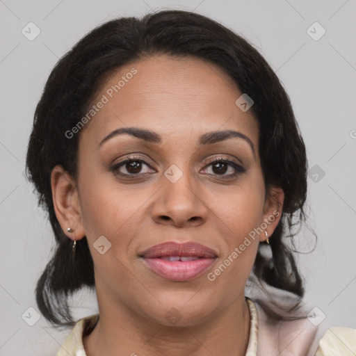 Joyful latino adult female with medium  brown hair and brown eyes