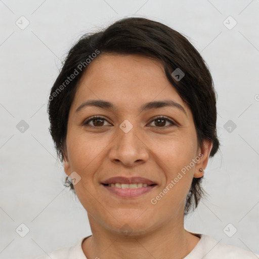 Joyful white adult female with short  brown hair and brown eyes